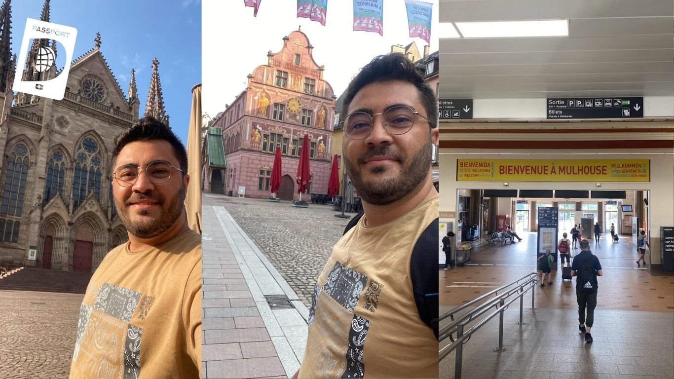 Mulhouse'da gotik katedral, pembe tarihi belediye binası ve karşılama tabelalı tren garı